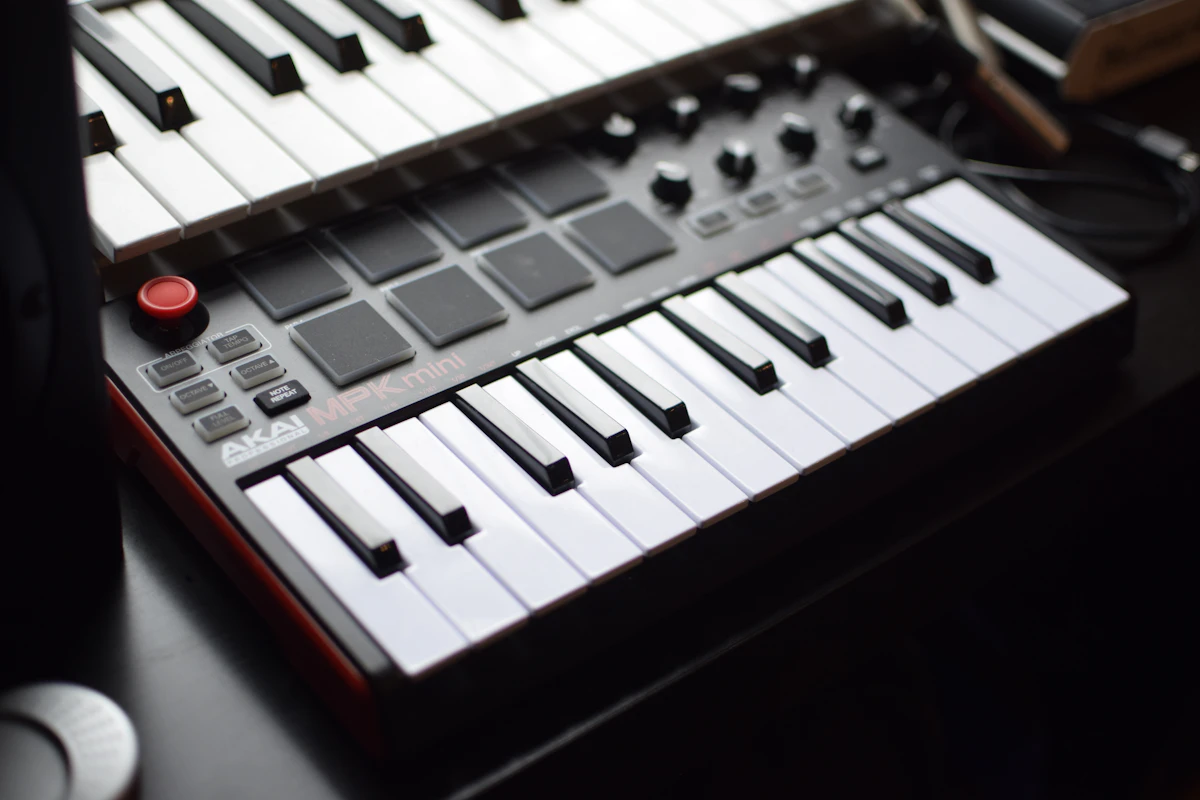 Akai MPK mini launchpad with glowing pads suggesting AI-driven beats
