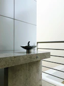 Minimalist stone tile sink in a modern bathroom with natural light