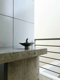 Close-up of a handcrafted sink with smooth curves and elegant texture.