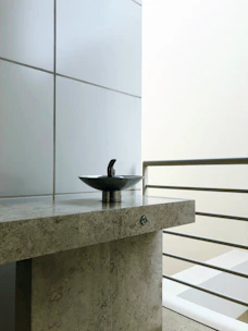 Elegant white ceramic sink with clean lines set against a minimalist background.