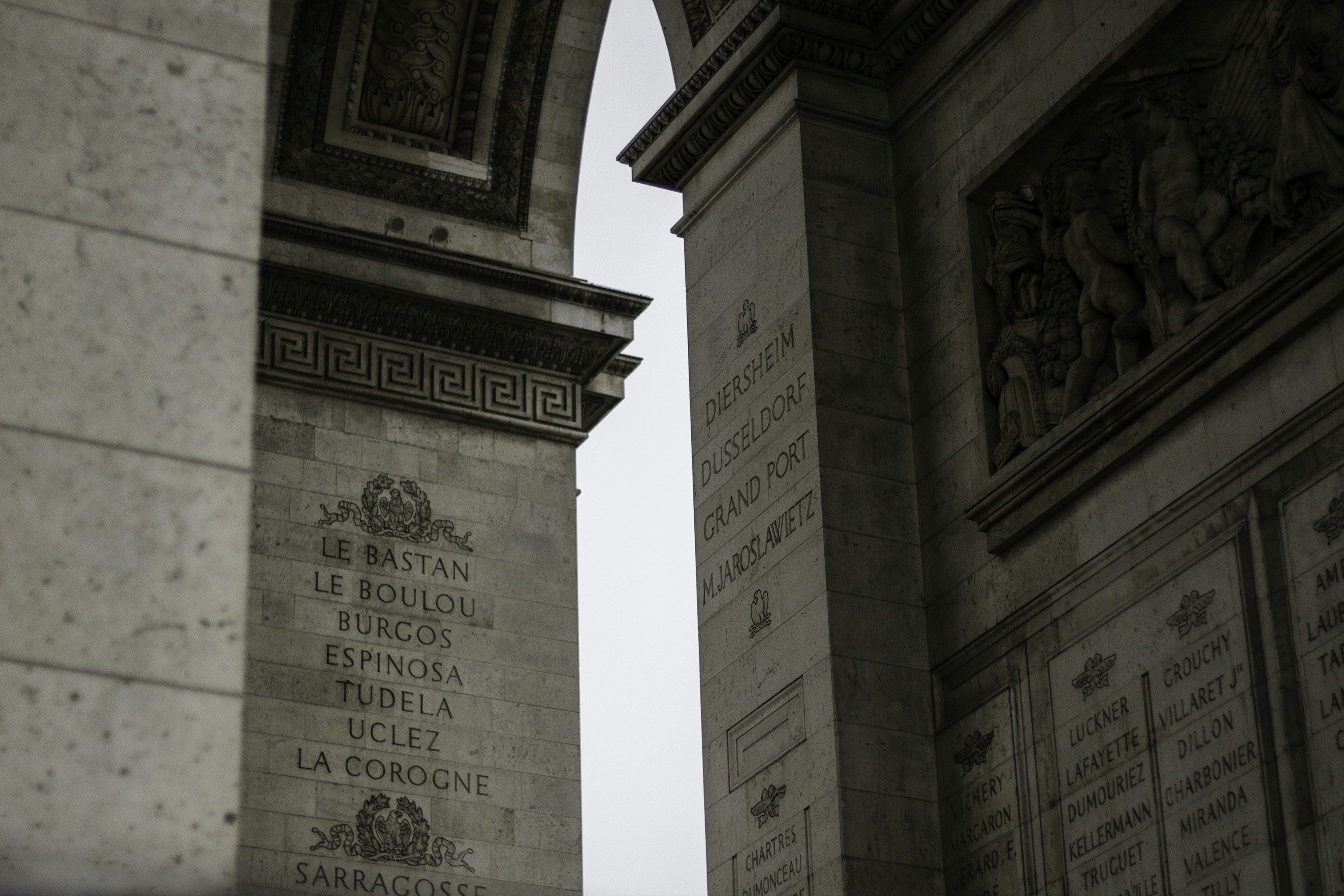 a couple of stone pillars sitting next to each other, Exploring Paris