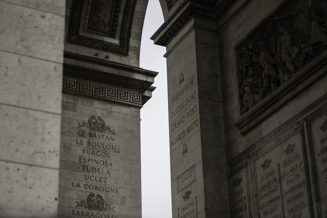 a couple of stone pillars sitting next to each other, Exploring Paris