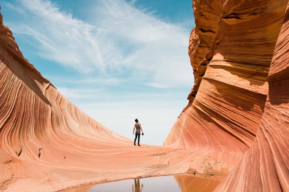 man on antelope canyon during daytime