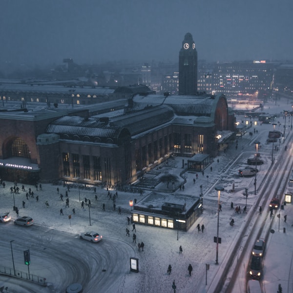 aerial photography of street at night covered with snow