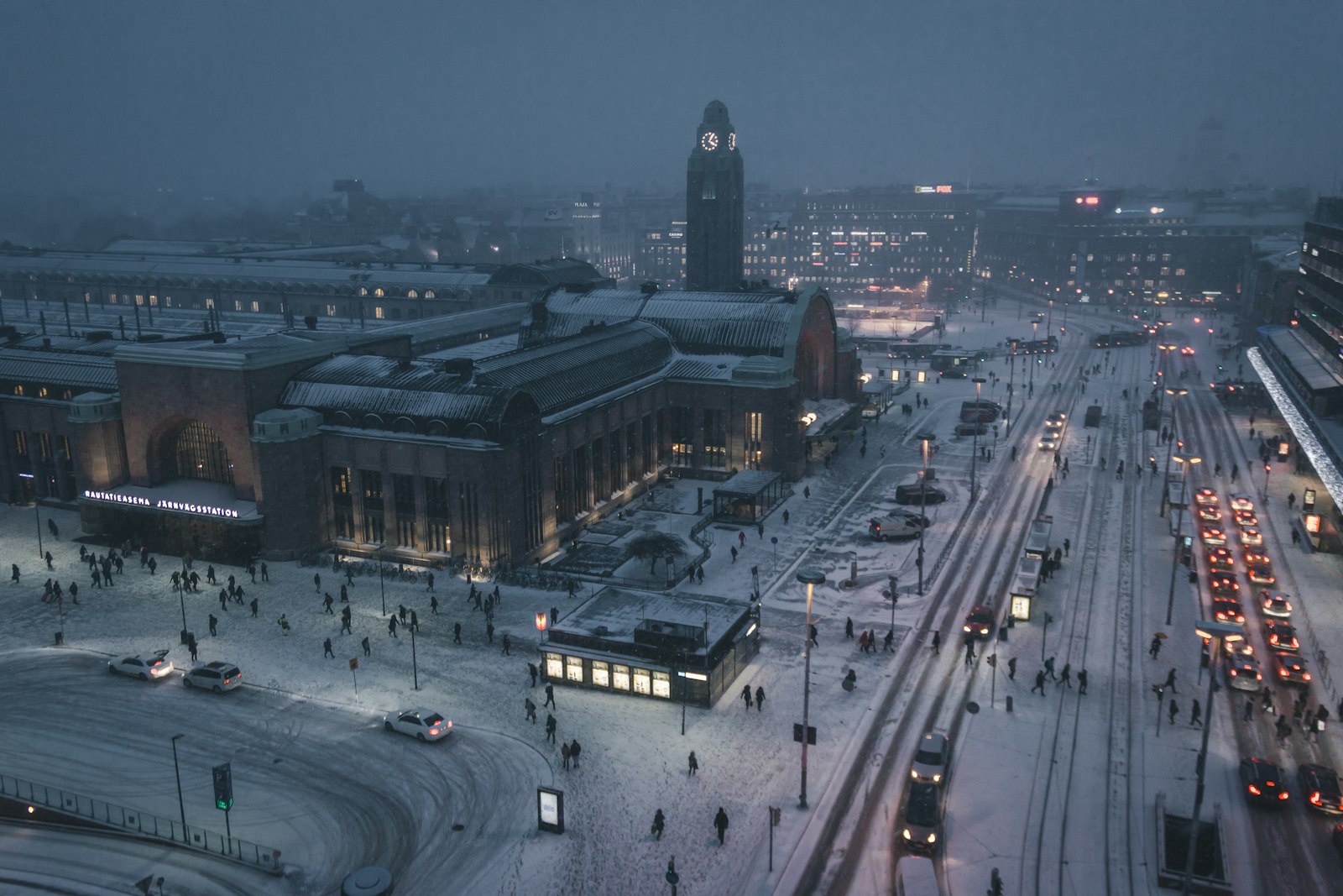 Aerial view of a snowy Helsinki street illuminated at night