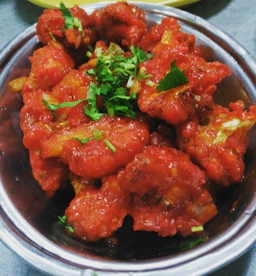 Air-fried cauliflower bites with a crispy golden crust, ready to enjoy.