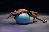 woman doing yoga on stability ball