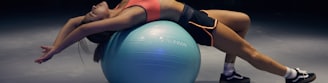 woman doing yoga on stability ball