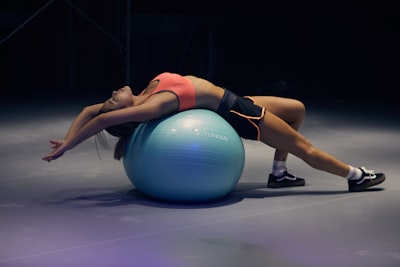 woman doing yoga on stability ball fitness google meet background