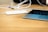 Close-up of a sleek portable charger on a wooden table.