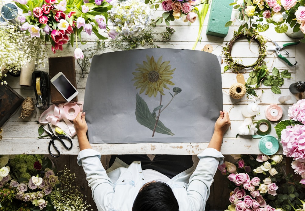 person painted sunflower