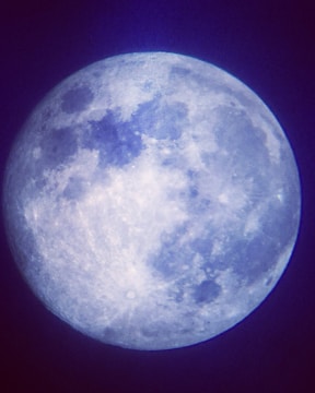 Close-up of a detailed lithophone moon with soft glowing light.