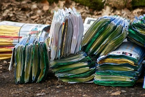 Stack of colorful flyers and brochures spread out on a table.