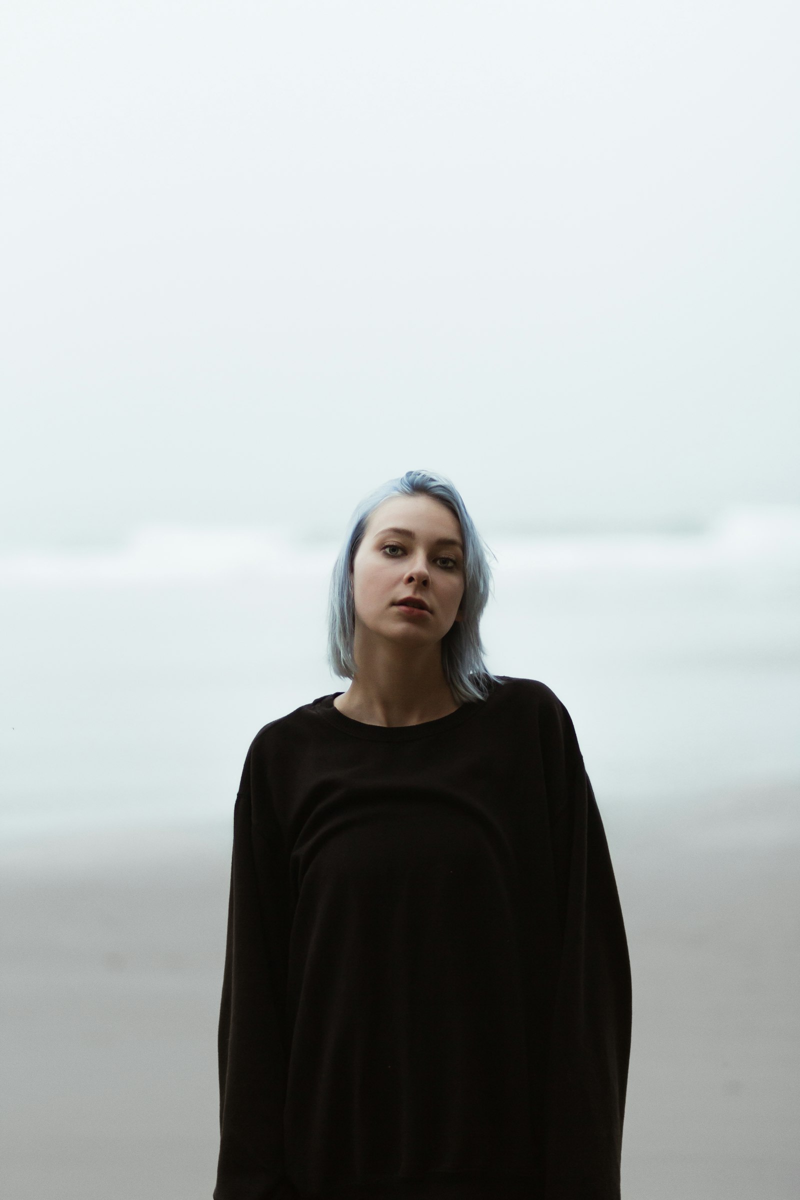 Canon EOS 60D + Canon EF 85mm F1.8 USM sample photo. Woman standing on shoreline photography