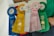 Five prize ribbons in different colors, each labeled with places awarded at the Ocean County Fair Fun Day. The ribbons are blue, yellow, white, pink, and green, representing third to sixth places.