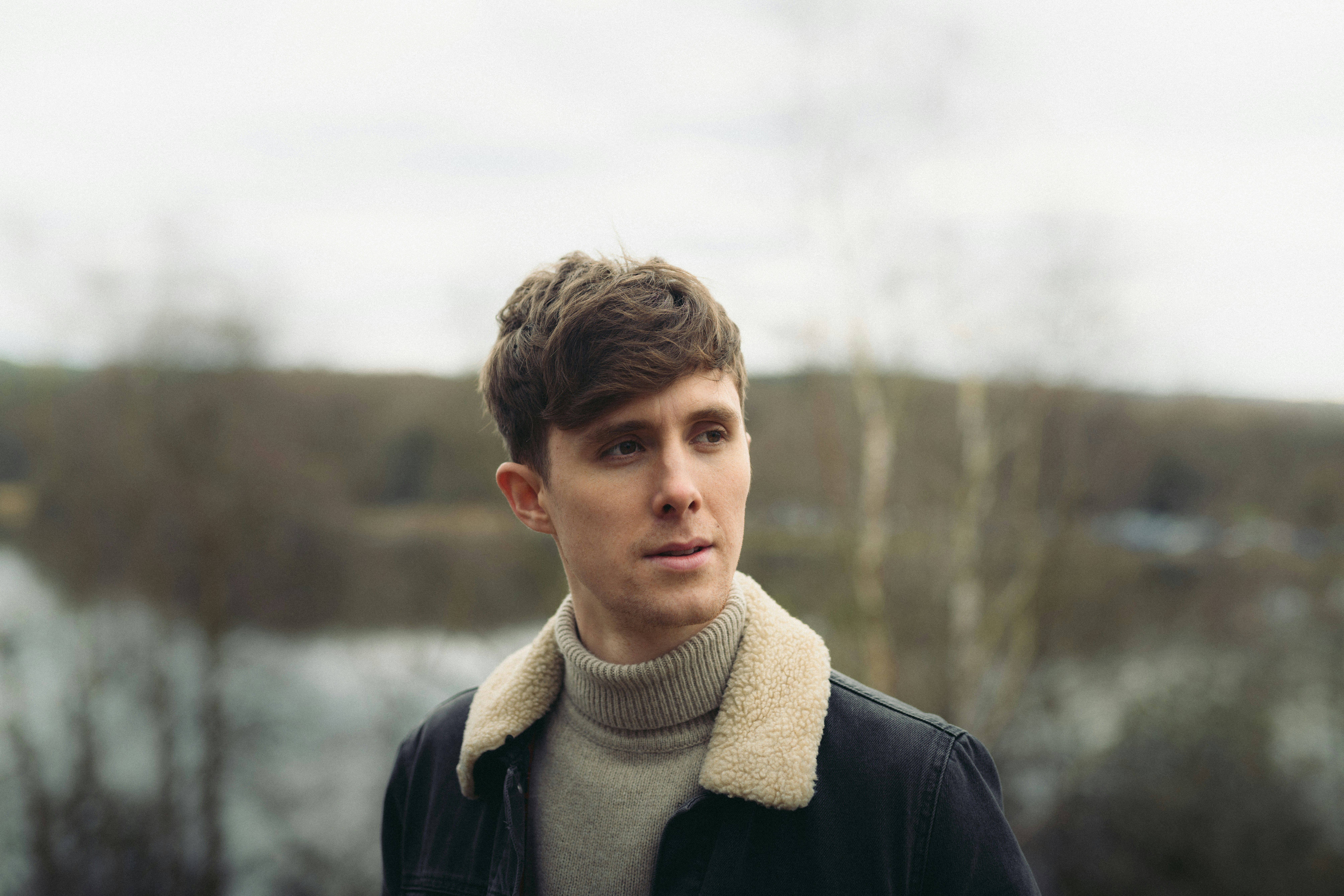 Nikon D850 + Sigma 50mm F1.4 DG HSM Art sample photo. Man in gray turtleneck photography
