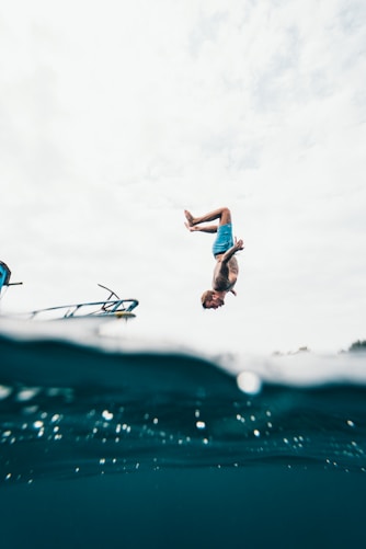 time lapse photography of man jumping at gili air by giligate