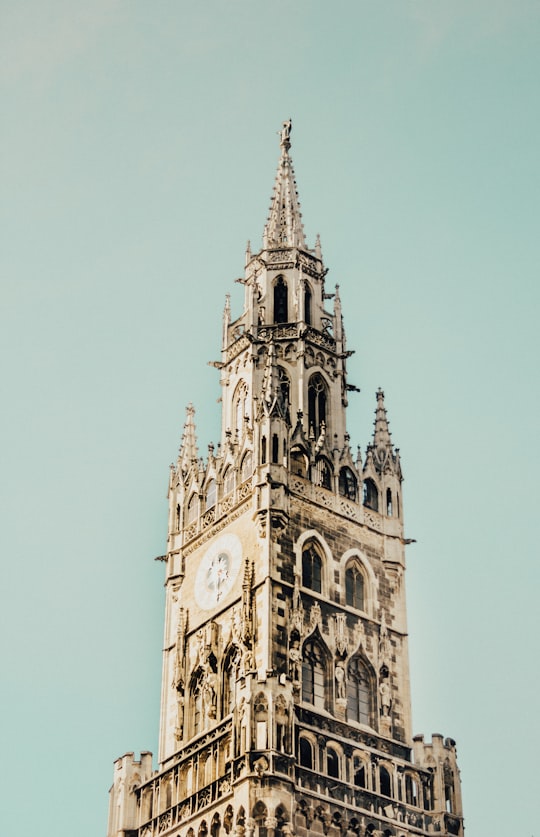 low-angle photography of beige concrete tower clock in Marienplatz Germany