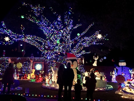 A colorful holiday display featuring vibrant decorations and joyful people celebrating together.