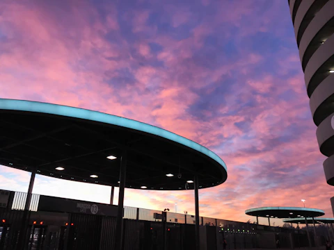 A vibrant photo showcasing a modern architectural project at sunset