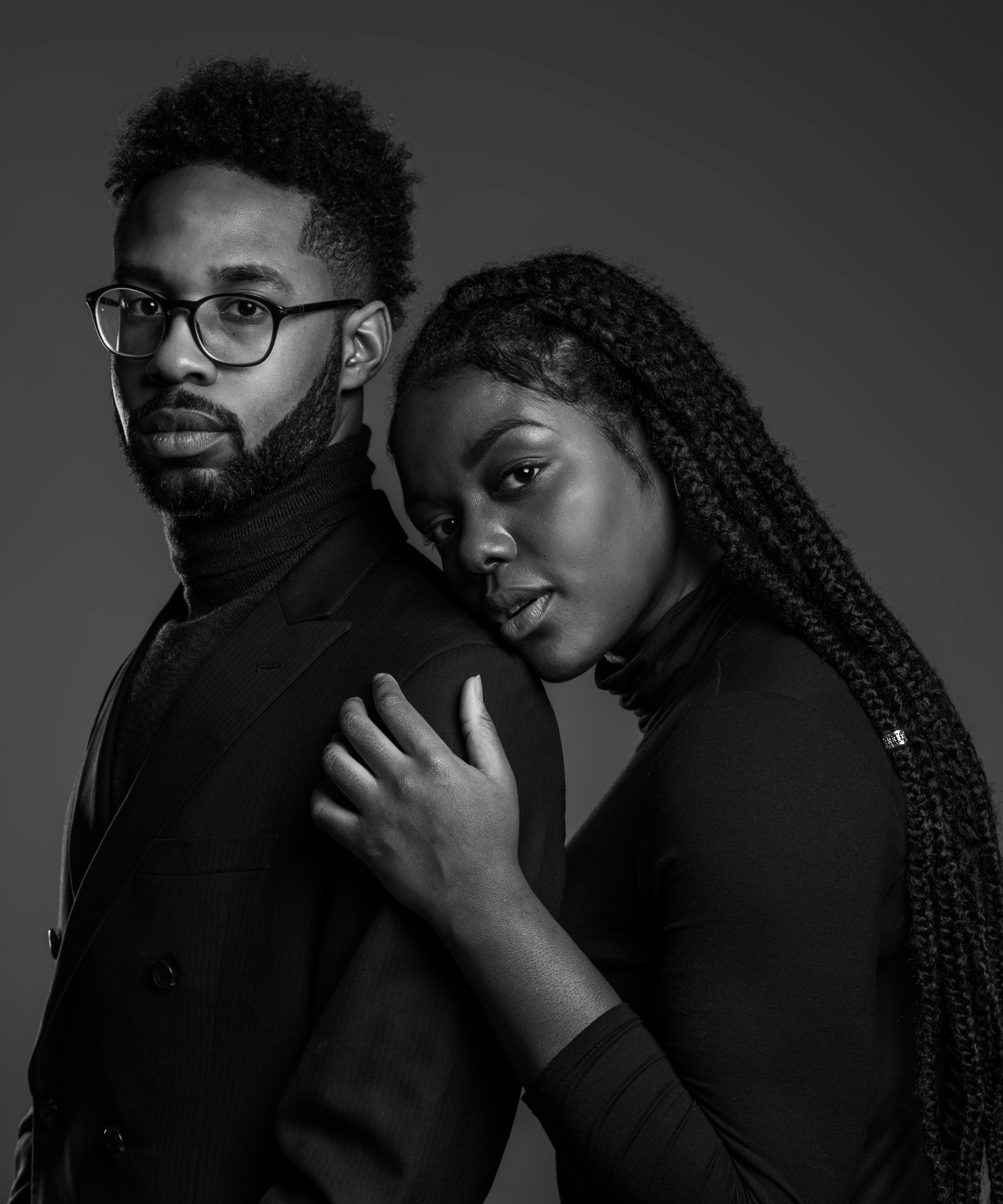 grayscale photo of man and woman posing