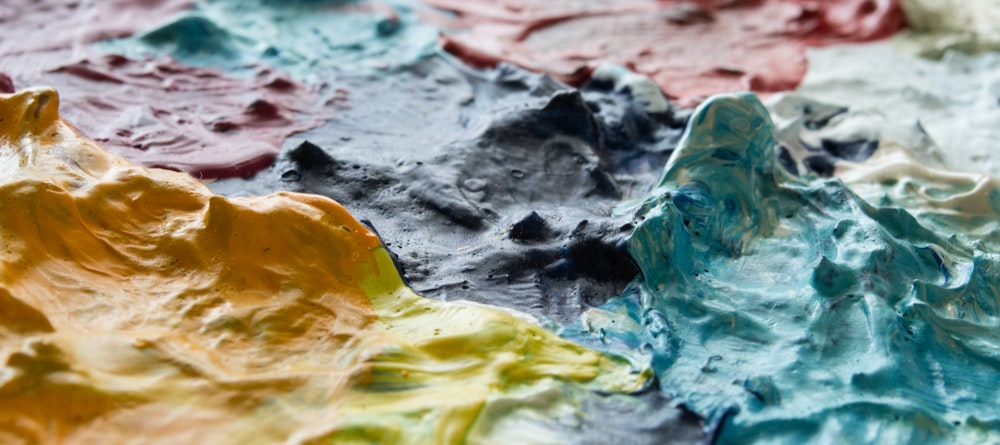 a close up of a multicolored paint palette
