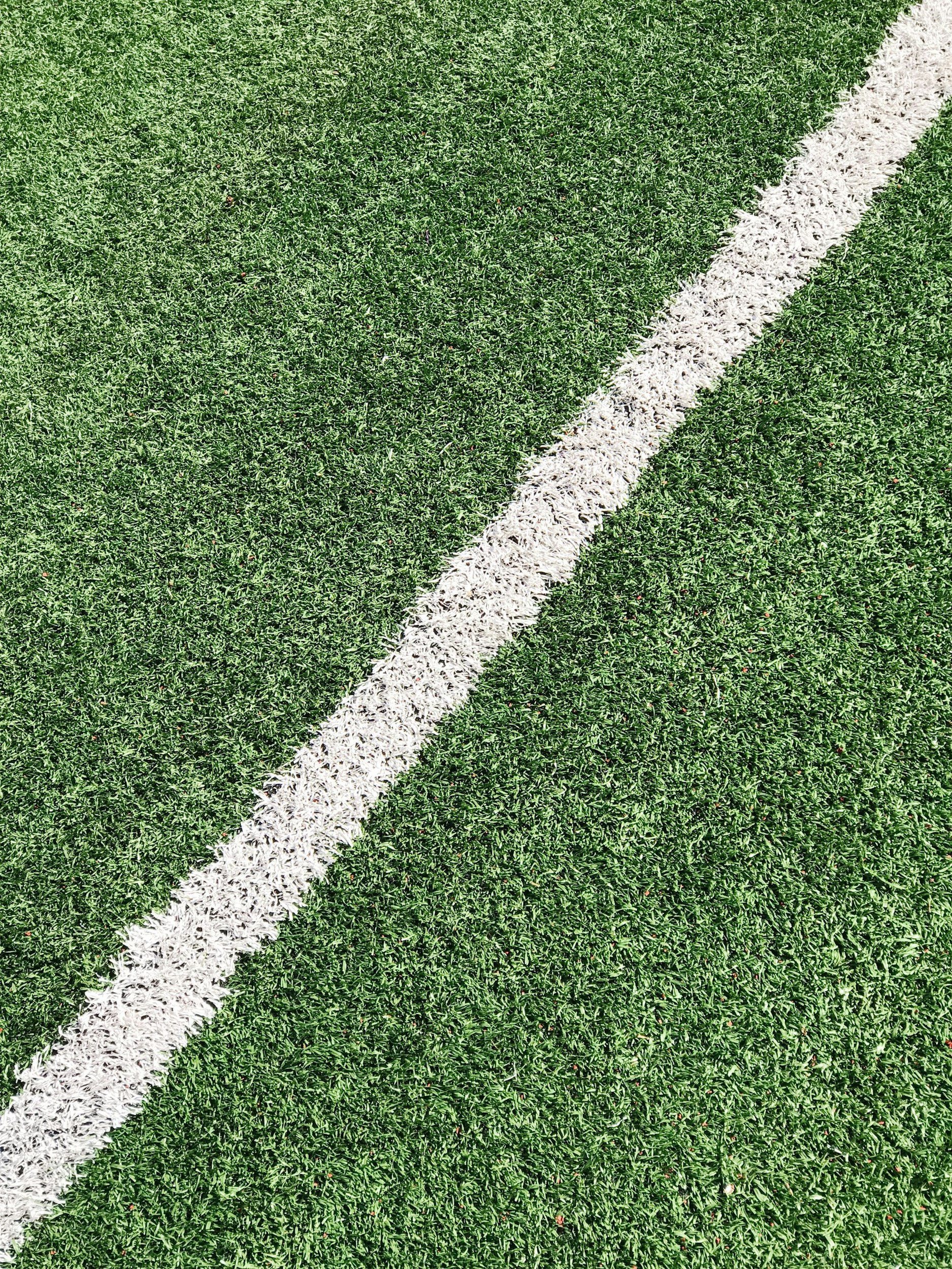 football pitch grass bumpy uneven