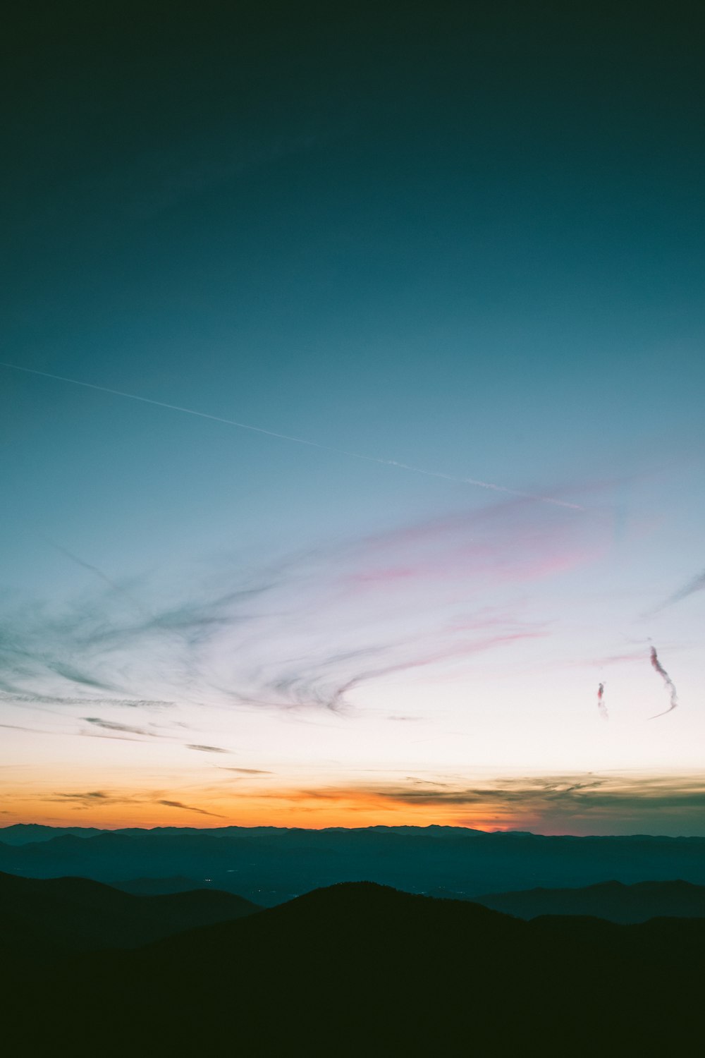 silhouette of mountains during sunset