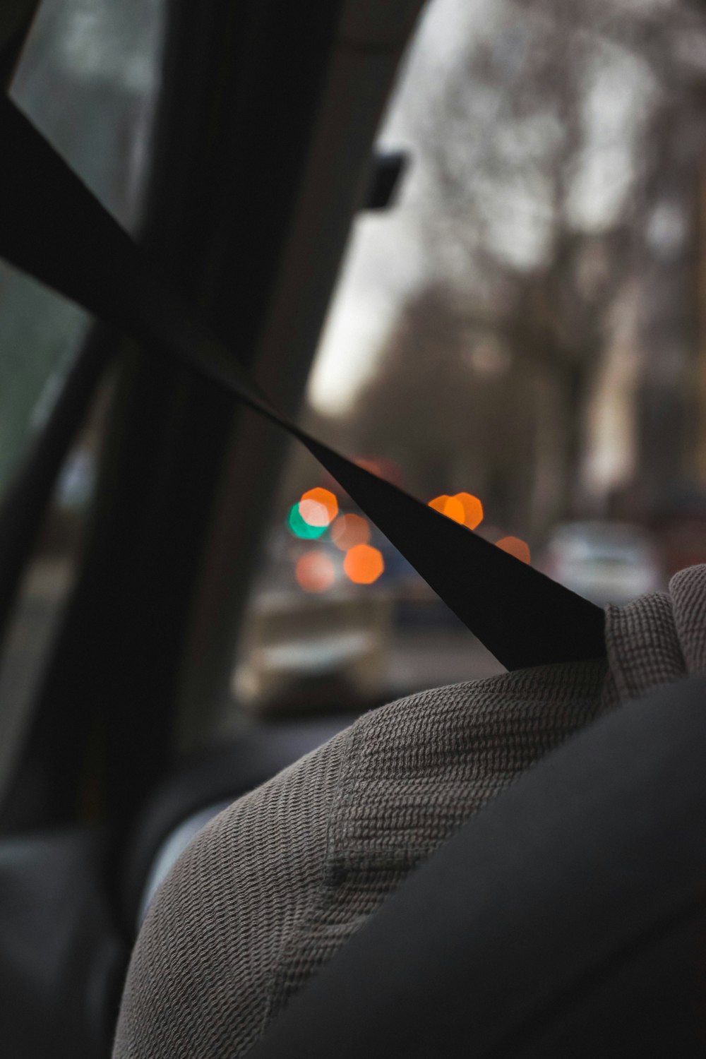 a pair of black scissors sticking out of a car window