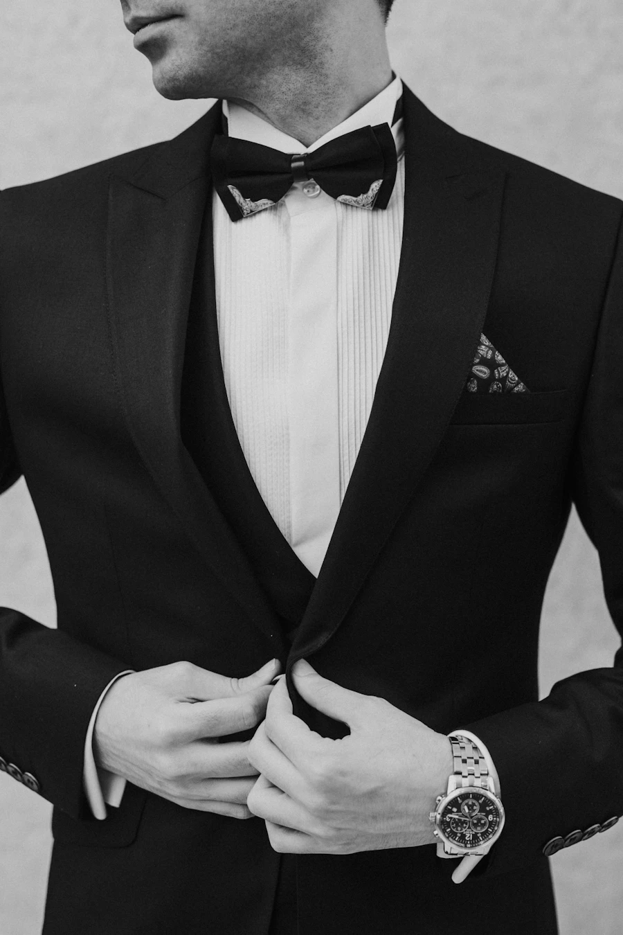 Groom in a tuxedo choosing the right color for his wedding
