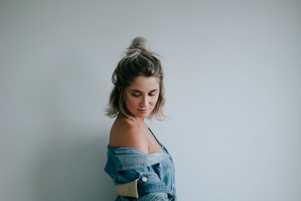 woman beside white wall