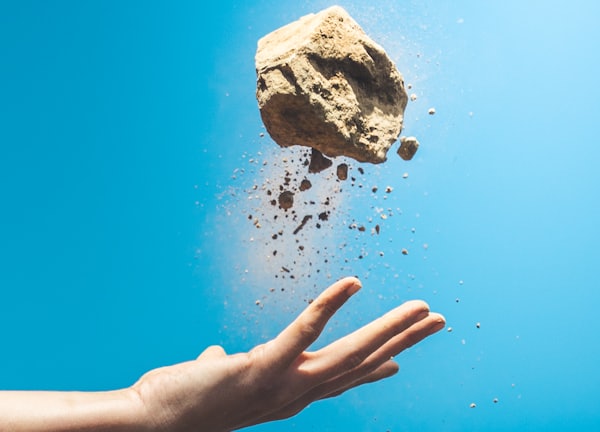 person throwing rock