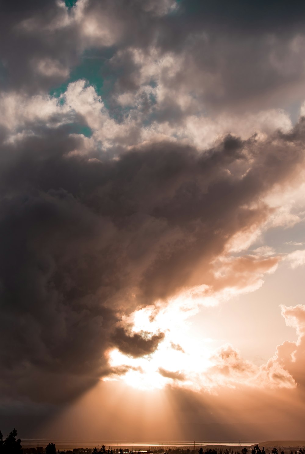 sun rays pierce through clouds