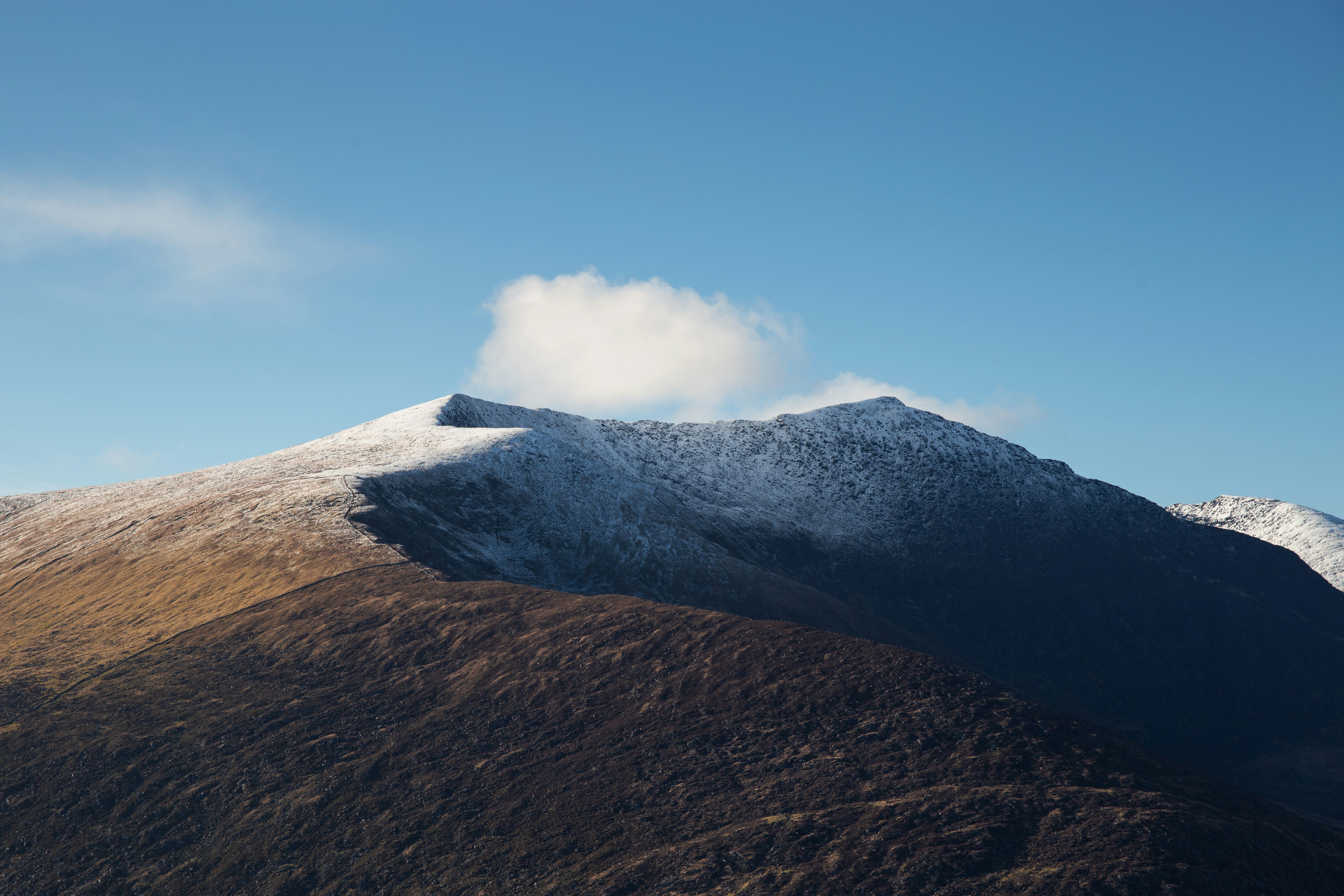 mountain near clouds