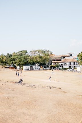 Local cricket match in action on a sunny afternoon in a Jalna neighborhood park