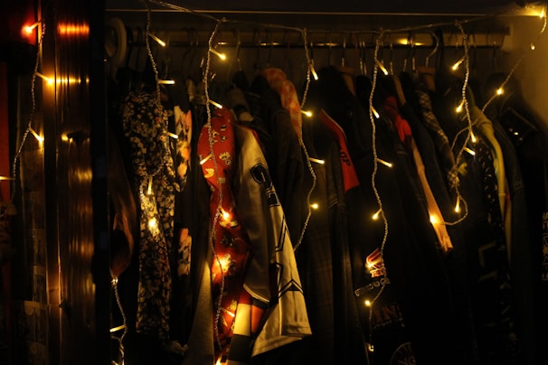 A cozy dressing room with clothes and accessories laid out, softly lit by morning light.