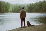 man standing near body of water