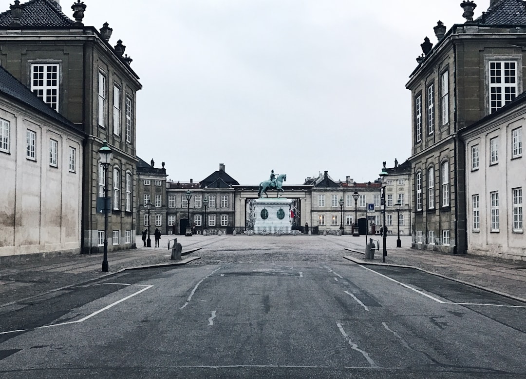 landscape photo of Trafalgar castle, This is Amalienborg Palace. The home of the Danish royal family located in Copenhag