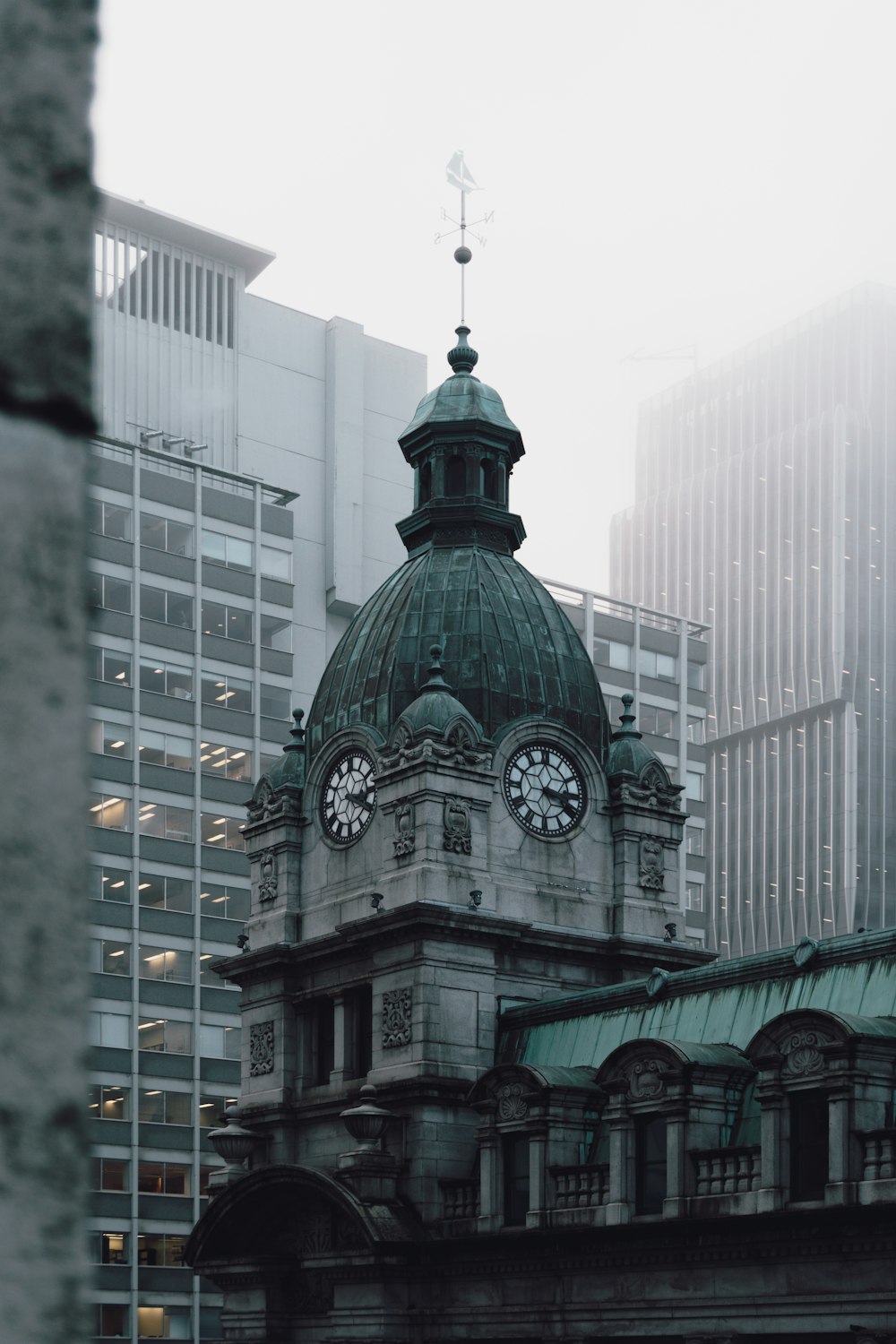 dome concrete building with clock at daytime