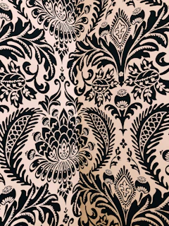 white and black damask textile