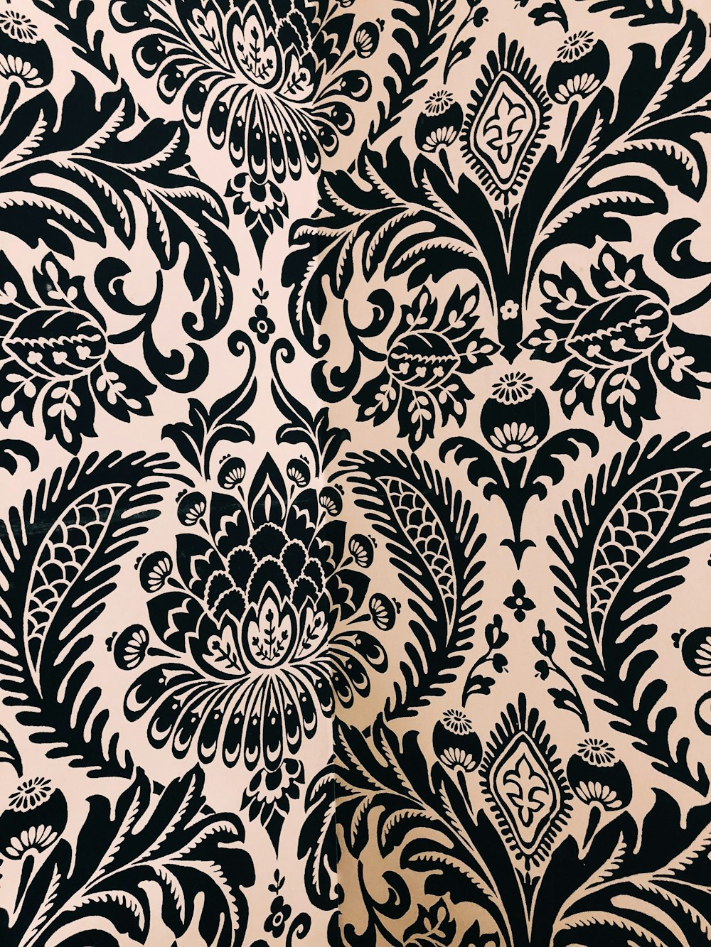 white and black damask textile
