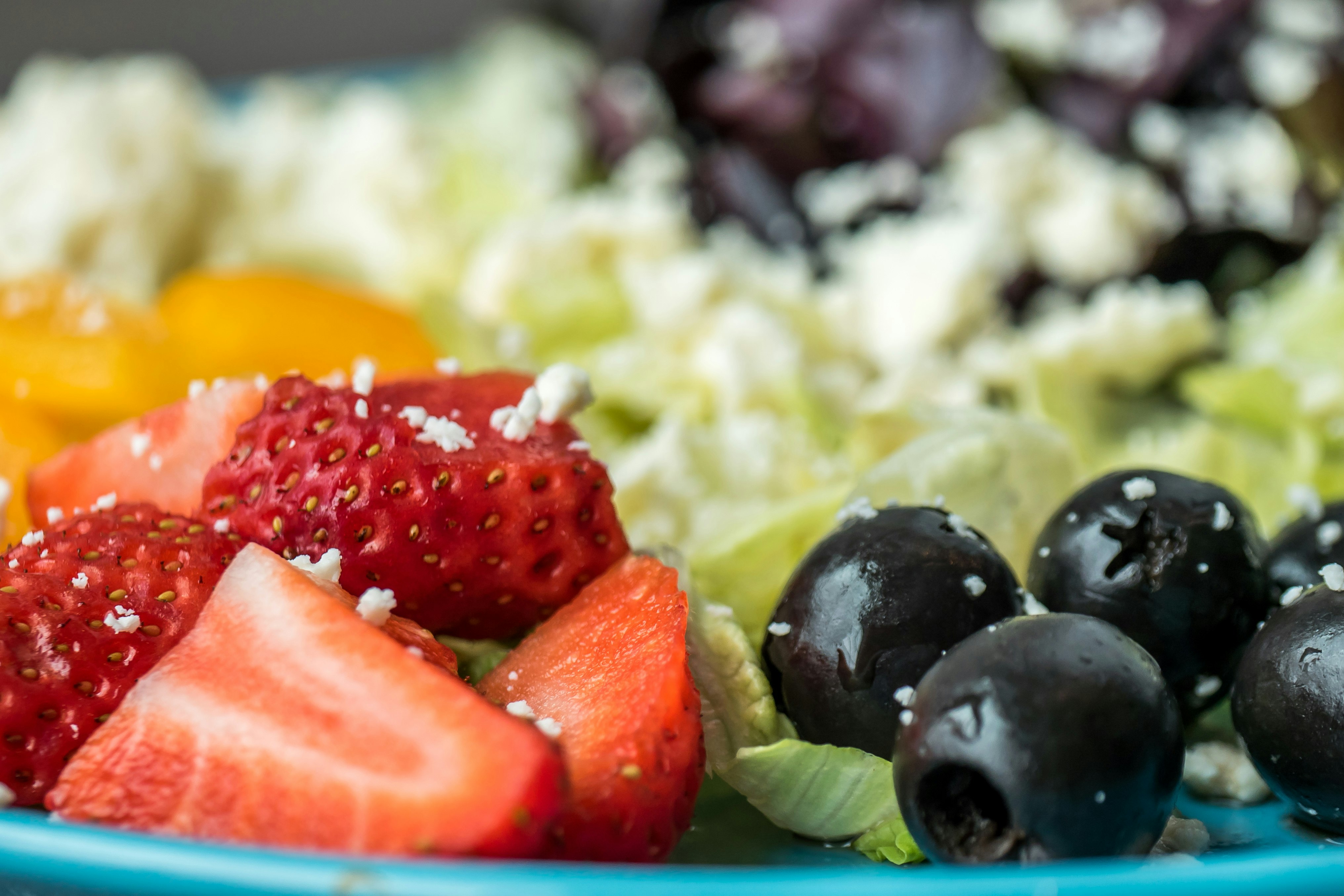 sliced strawberries with blackberries