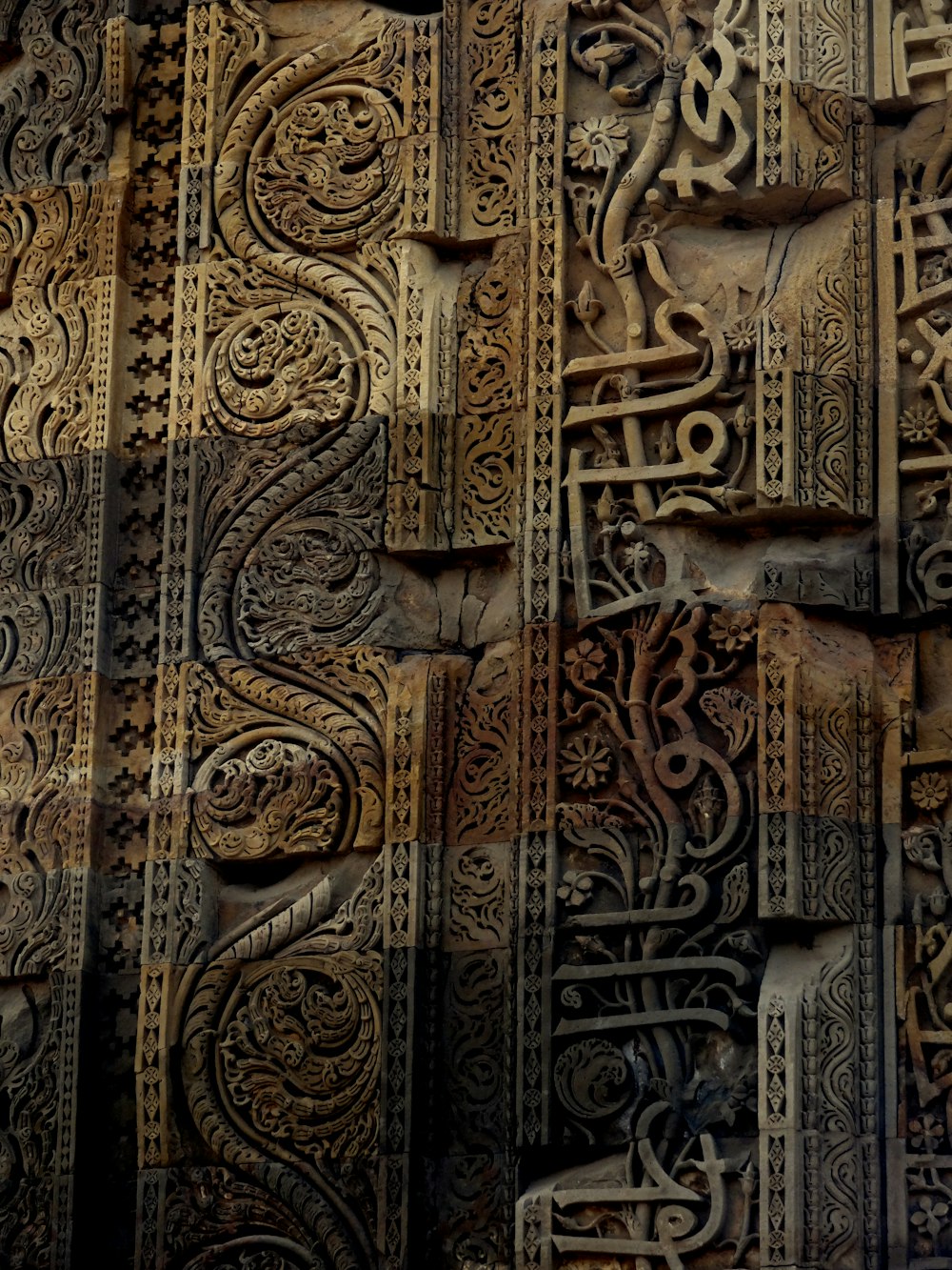 closeup photo of wooden engraved wall decor