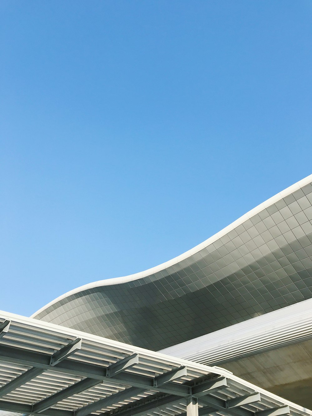 white high-rise building under blue sky