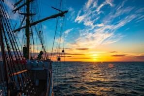 An inspiring sunset shot of the training ship sailing, symbolizing new career horizons at sea.