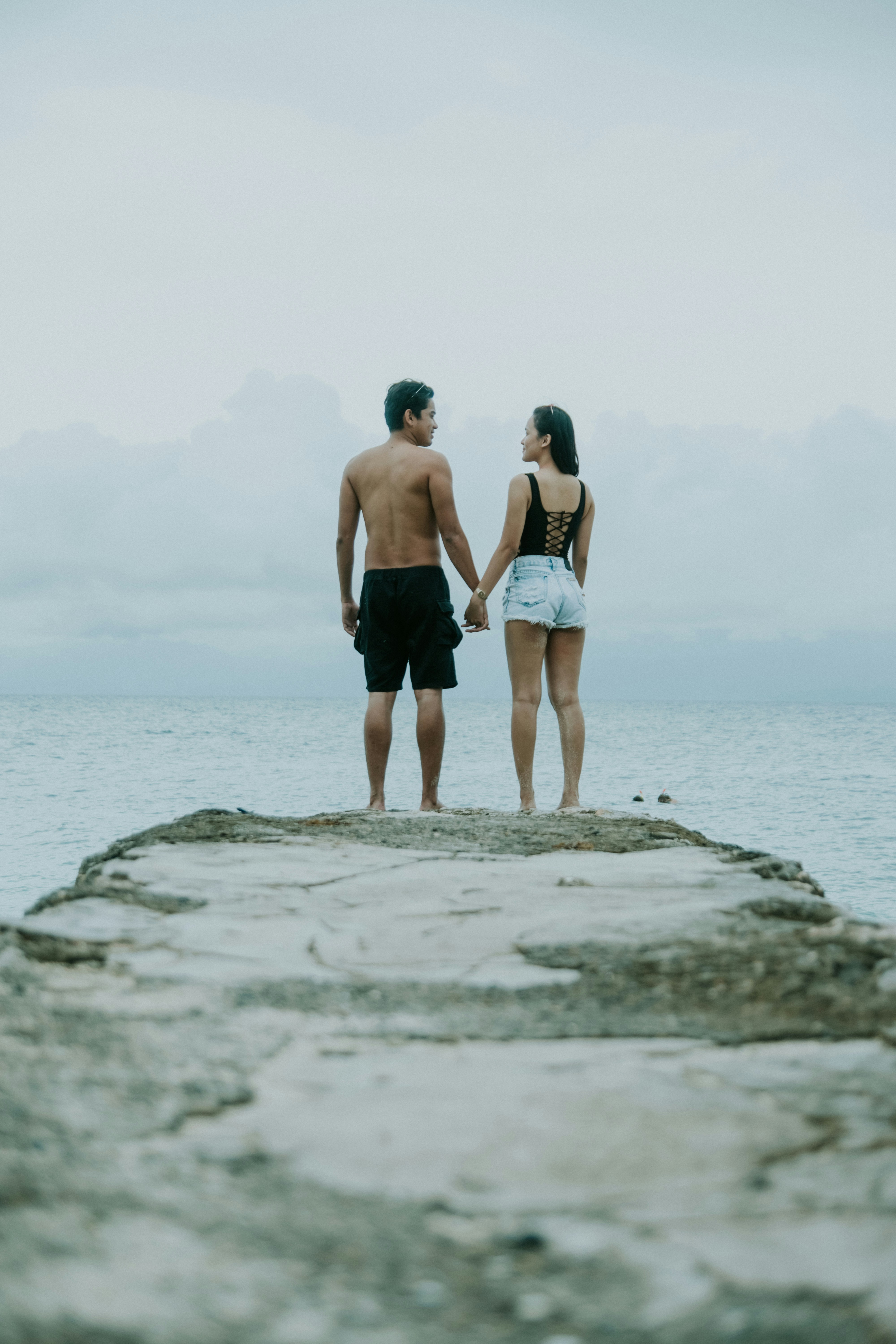 great photo recipe,how to photograph cebu (2018); man and woman holding hands standing on edge of cliff