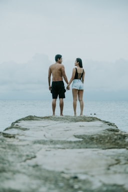 the journey ahead,how to photograph cebu (2018); man and woman holding hands standing on edge of cliff