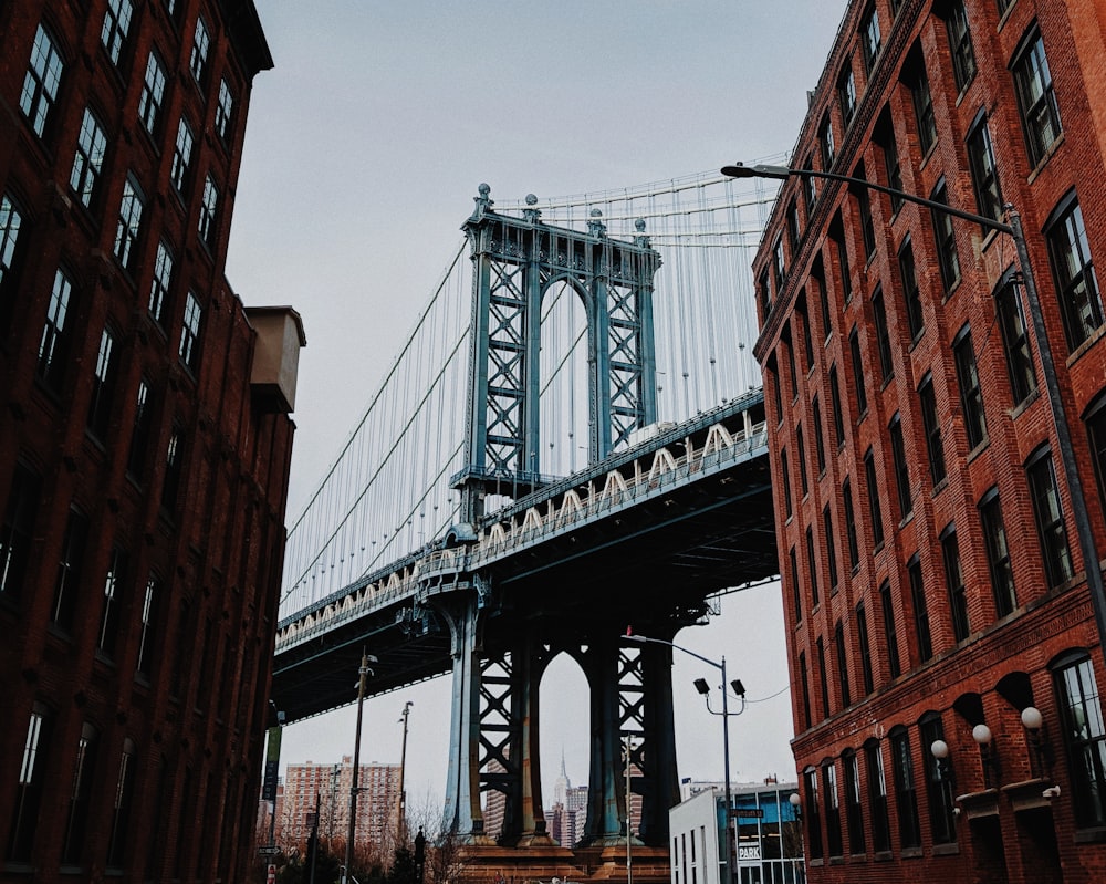 gray metal bridge under clear sky