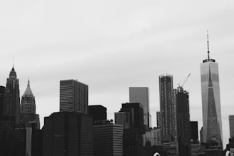 grayscale photo of high-rise buildings
