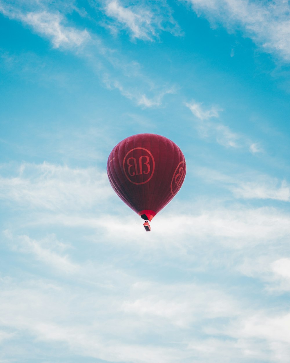 red hot air balloon in the sky